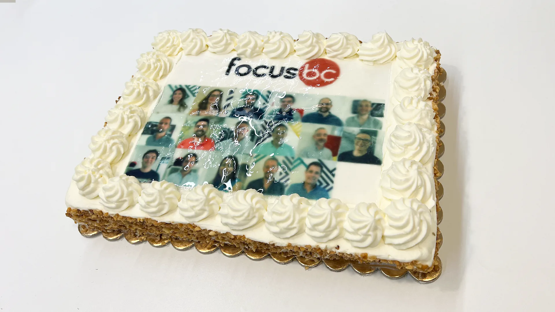 Birthday cake with photos of the Focus BC members.