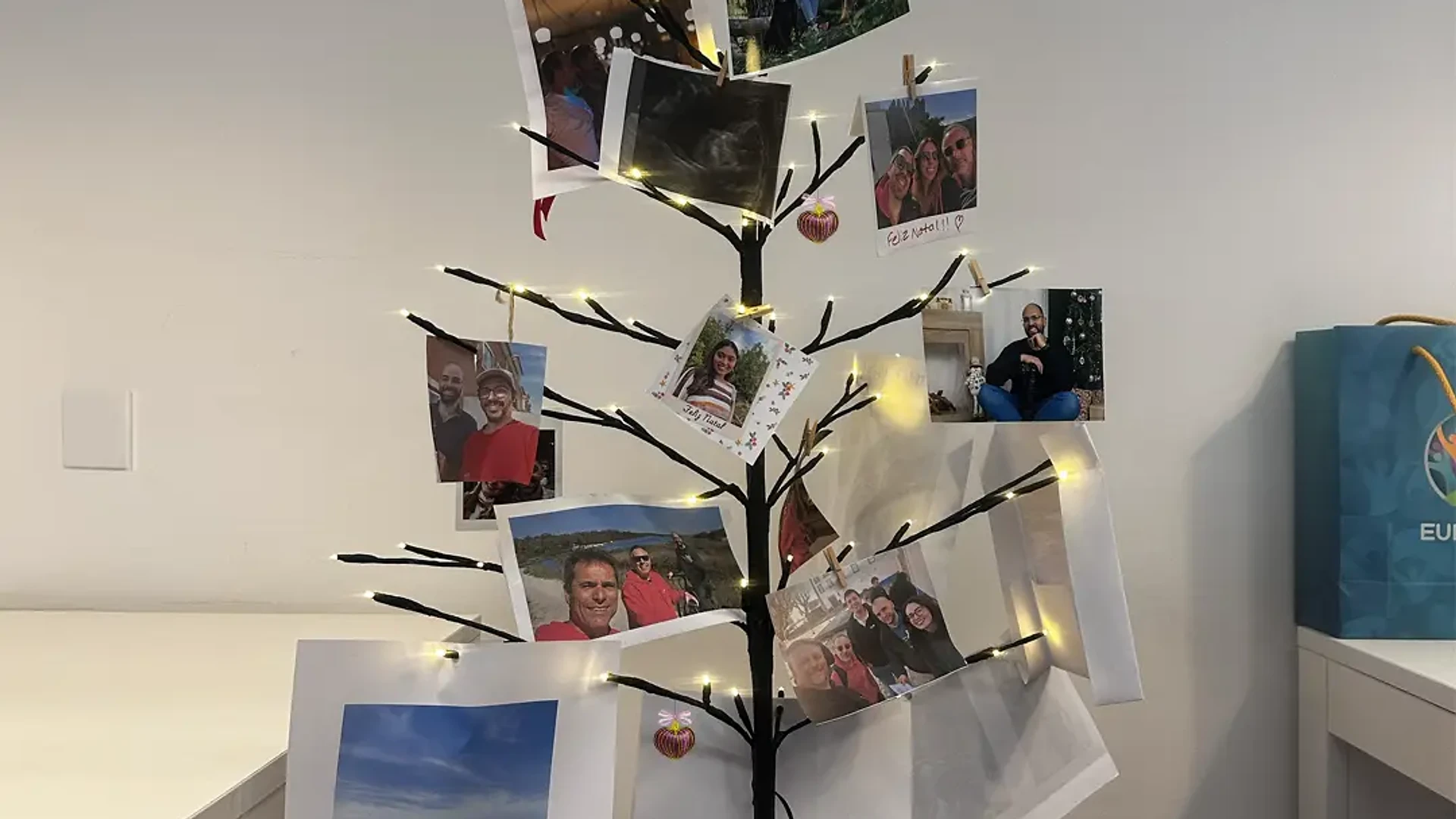Founders with Santa hats and holiday glasses stand arm in arm, smiling at the camera during a Christmas celebration.