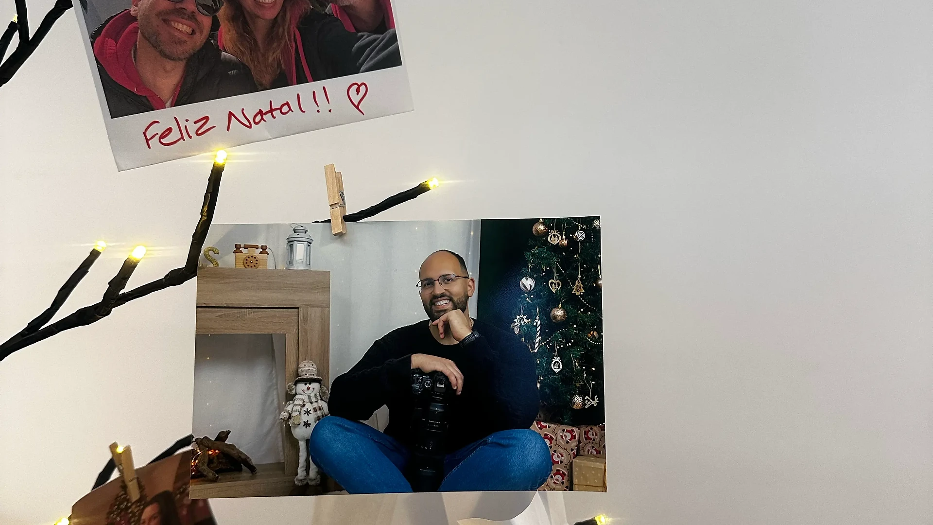 Founders in Santa hats and festive glasses laughing and embracing for a holiday photo indoors.
