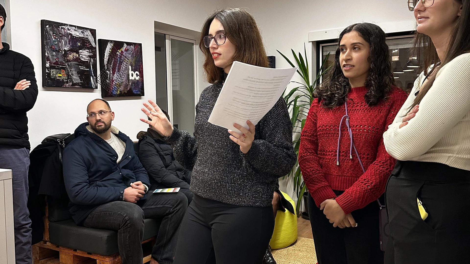 Close-up of printed photos hanging from the tree, with handwritten Christmas wishes visible below them.