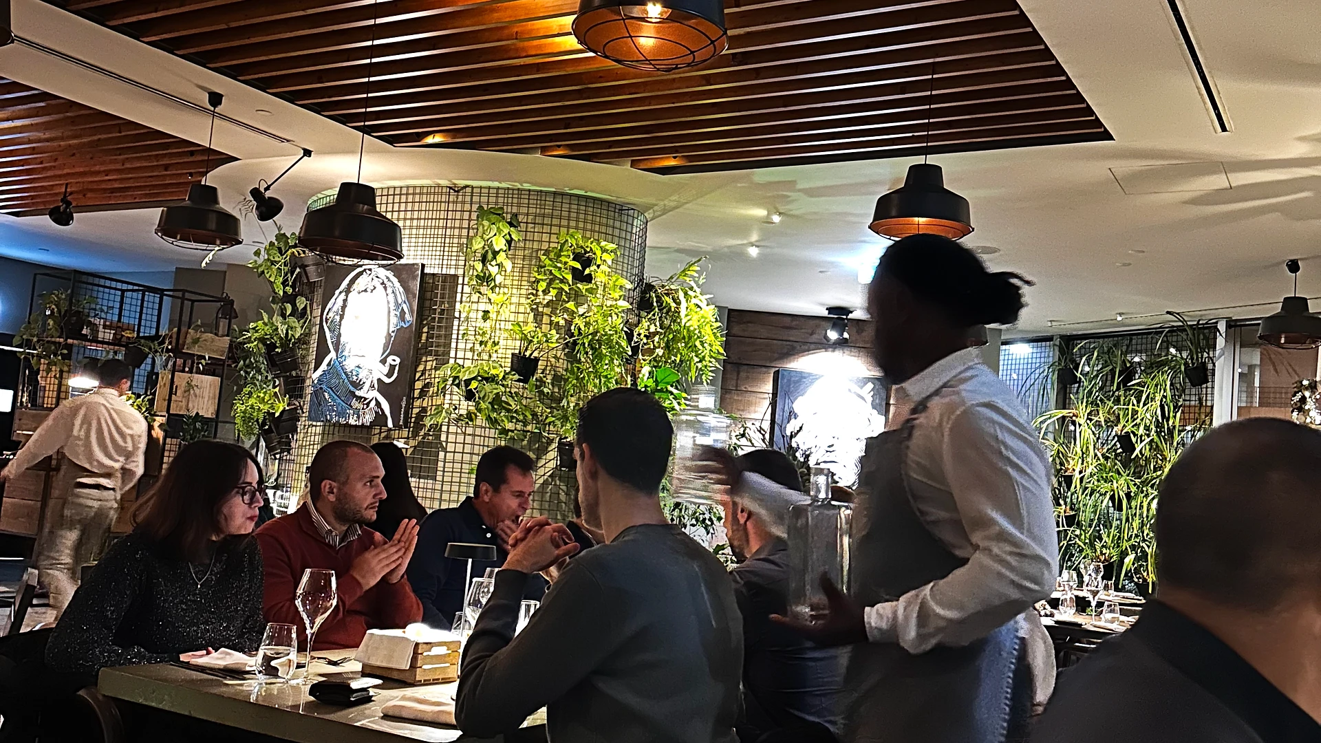 Open car trunk filled with grocery bags containing donated food items ready for delivery.