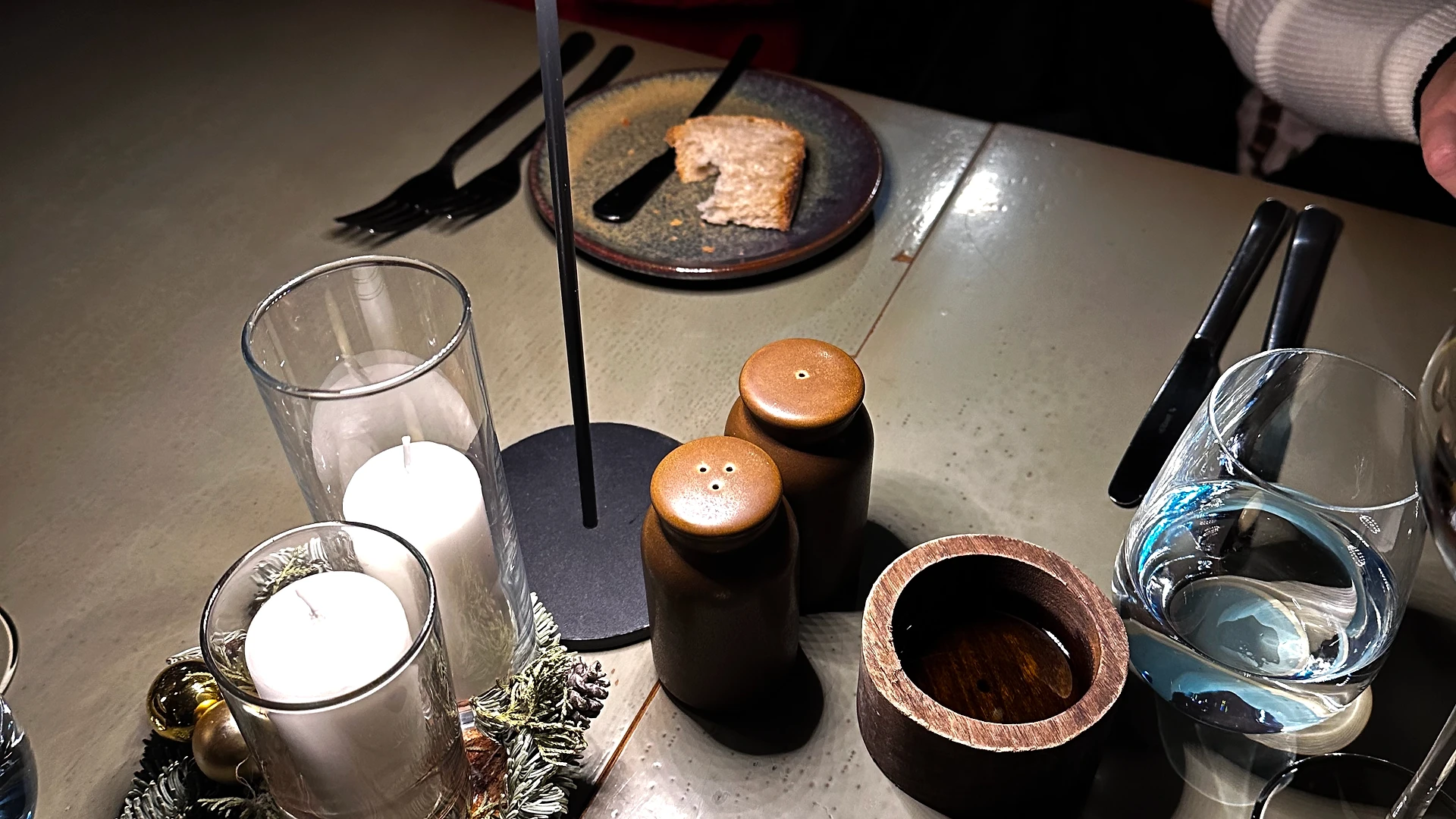 Multiple grocery bags with food supplies placed beside colorful bean bags in an office space, prepared for donation.