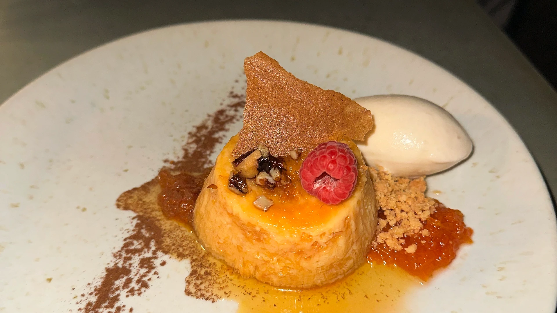 A team member reading from a paper while others stand nearby listening during the gift exchange.