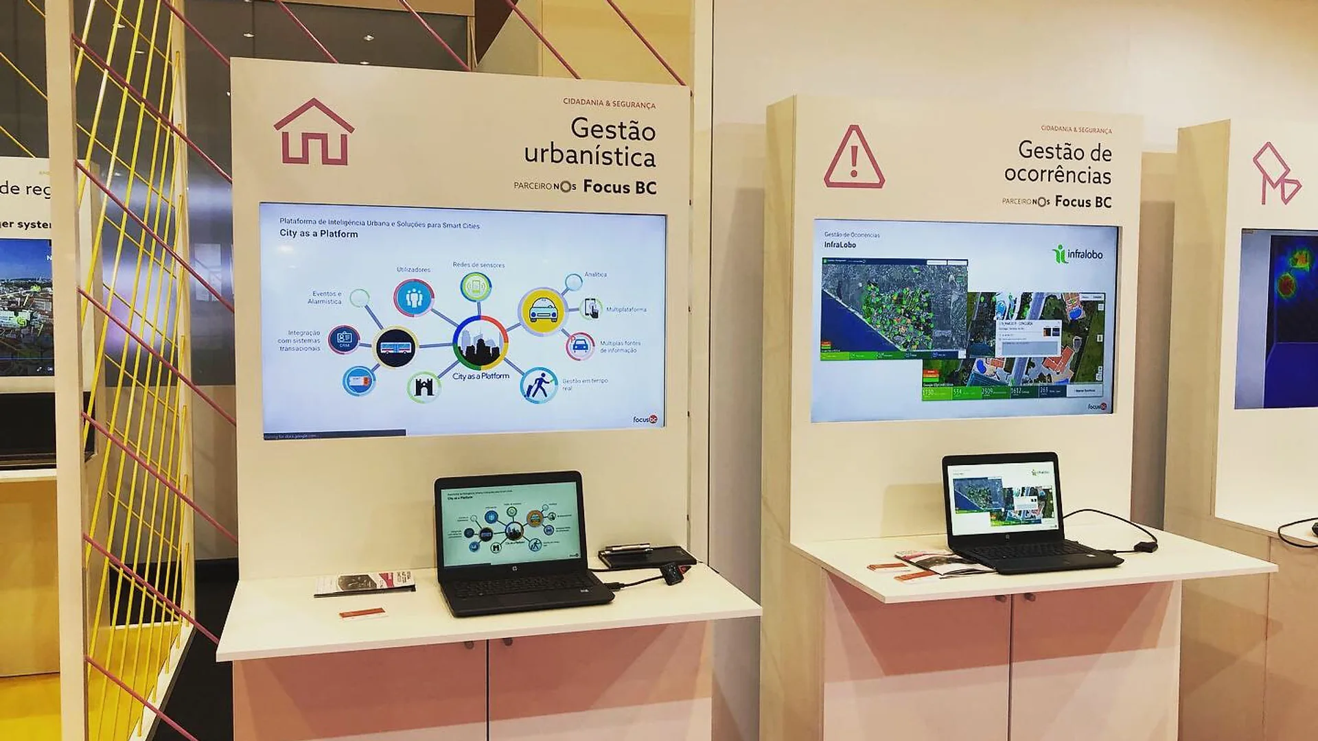 Focus BC team members posing together at their exhibition stand during Portugal Smart Cities Summit.