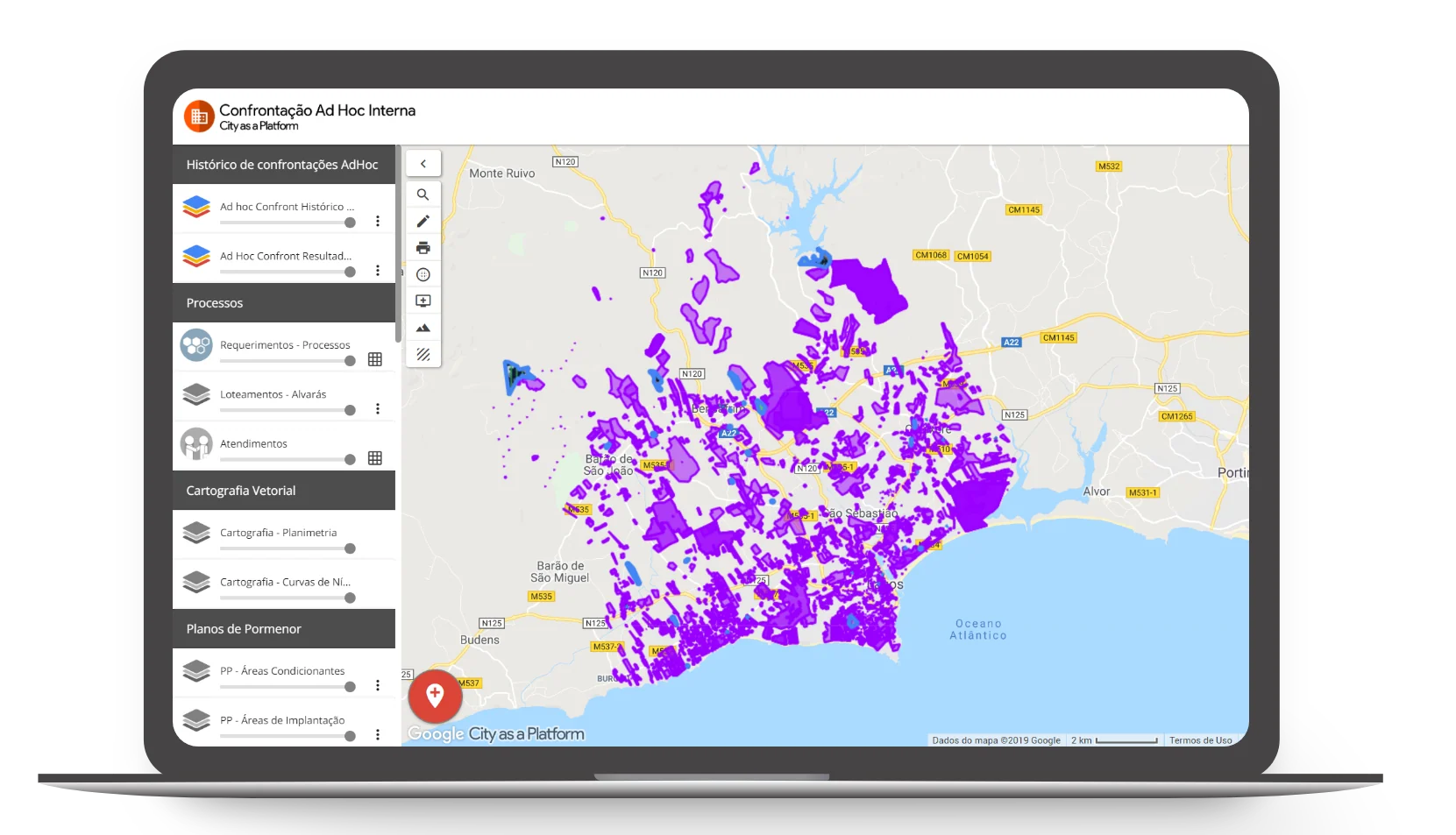 City data platform displayed on a laptop showing purple-highlighted zoning and planning layers across a coastal municipality map.